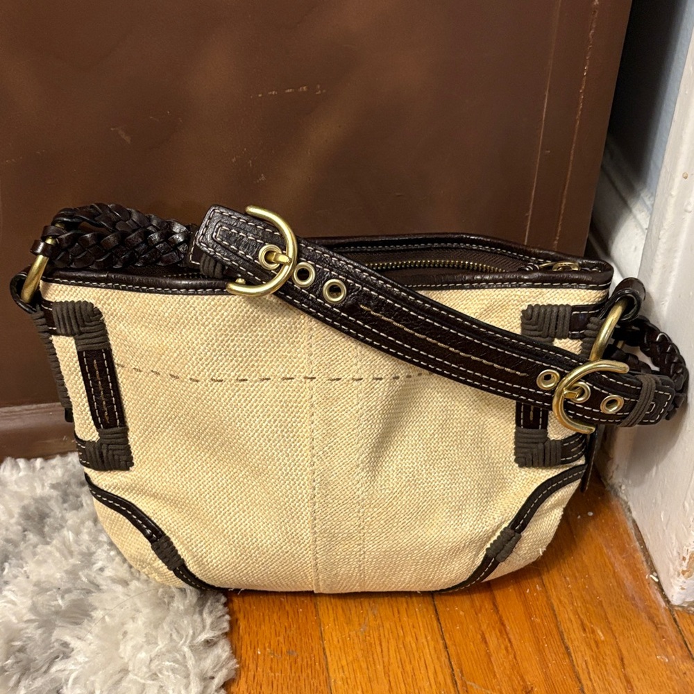 Coach woman’s beige straw Leather Bag